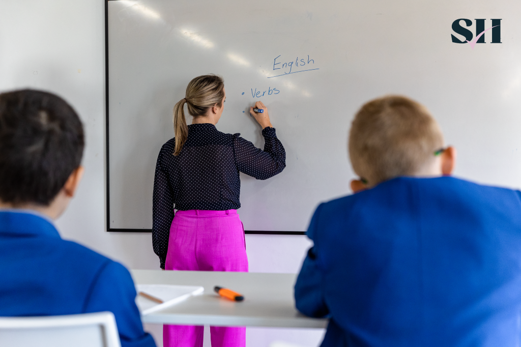 English Teacher Writing On A Board